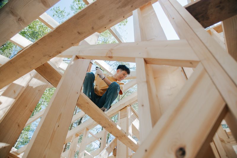 Contractor building the wooden frame of a home